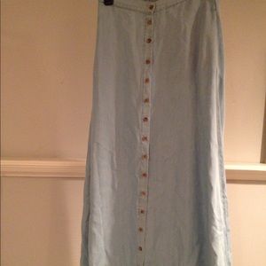 Light denim long button skirt.